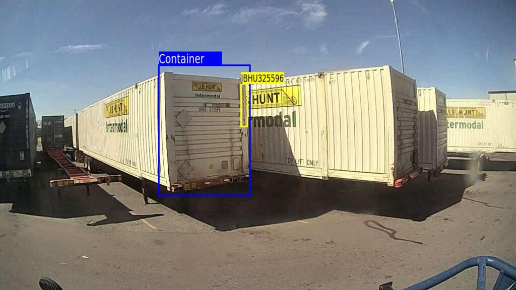 An AI camera identifies an intermodal container and automatically reads its vertical ID code helping automate yard check-in and asset tracking.